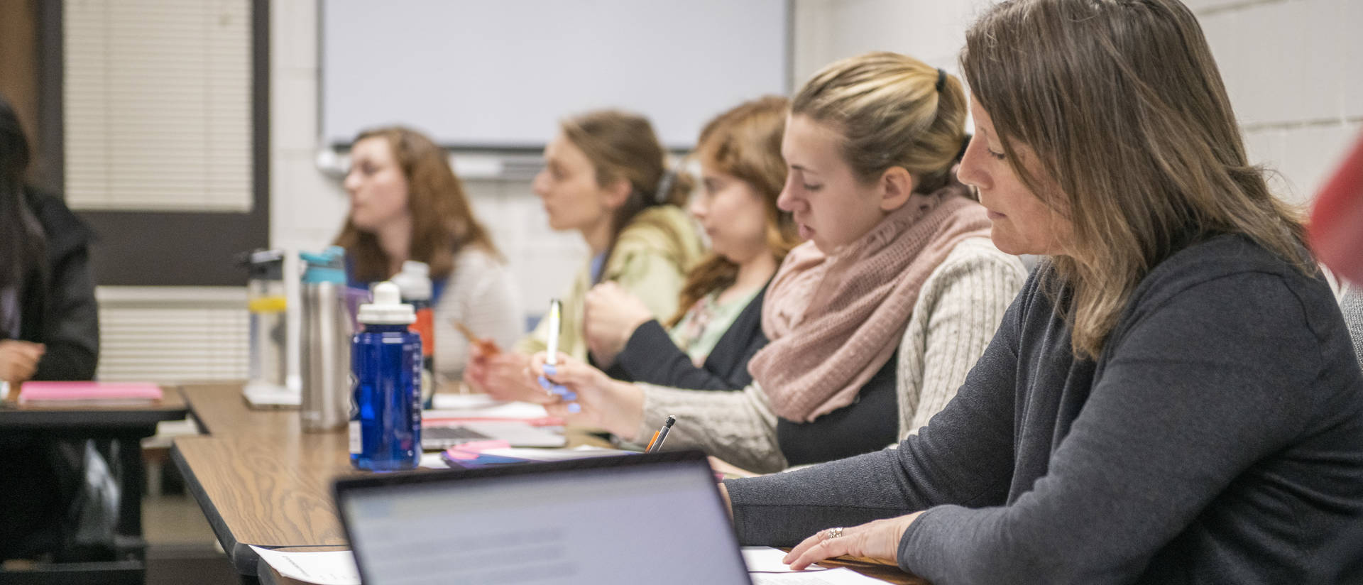 A group of Blugolds have a meeting in the Human Development Center on campus.