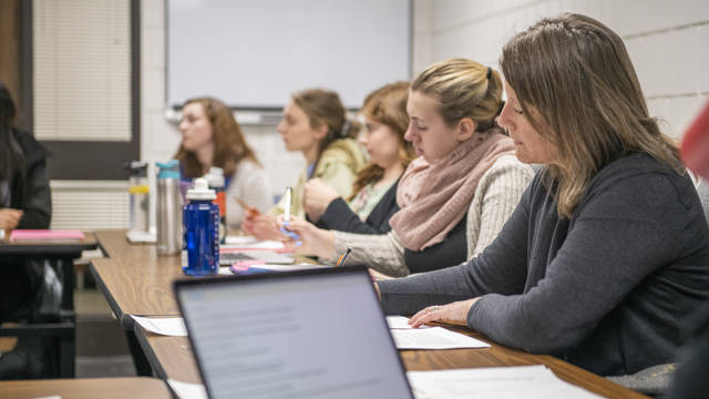 A group of Blugolds have a meeting in the Human Development Center on campus.