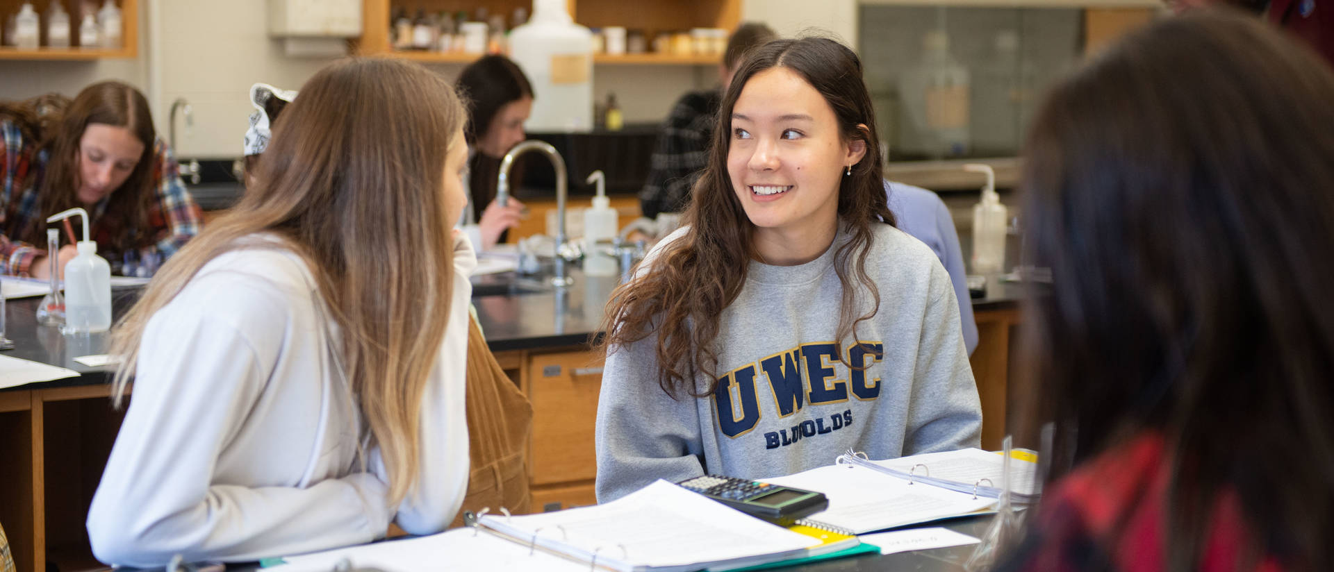 Students talk in class during a lab.