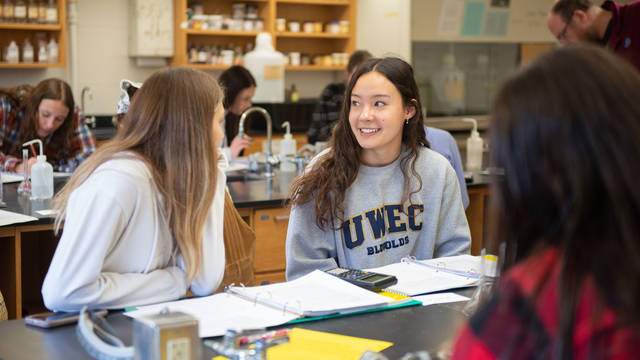 Students talk in class during a lab.