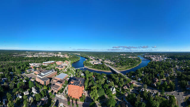 aerial campus shot with river bend