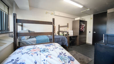 Towers Hall double room (viewed from wall opposite door) with two beds, two desks, two closet spaces.