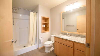 Bathroom with shower, sink and toilet