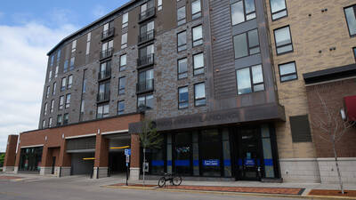 Front entrance of Haymarket residence hall showing exterior of building and entrance to parking ramp