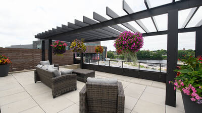 Patio deck of Haymarket Landing with outdoor seating overlooking the Chippewa River