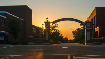 Sunset colors behind the University of Wisconsin Eau Claire arch.