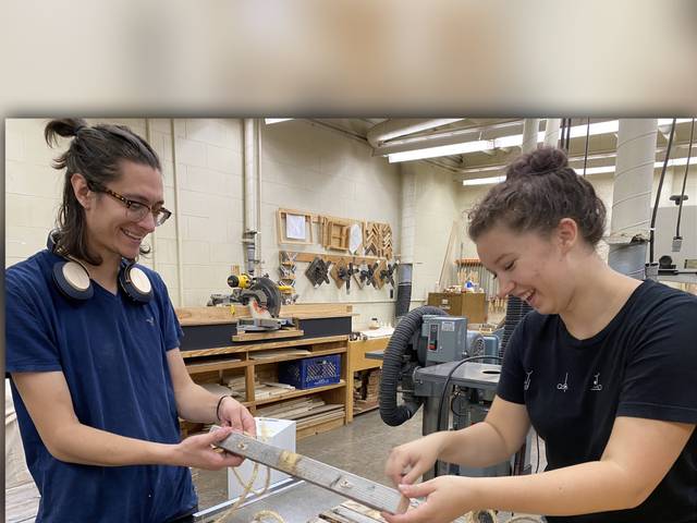 male and female student in woodshop