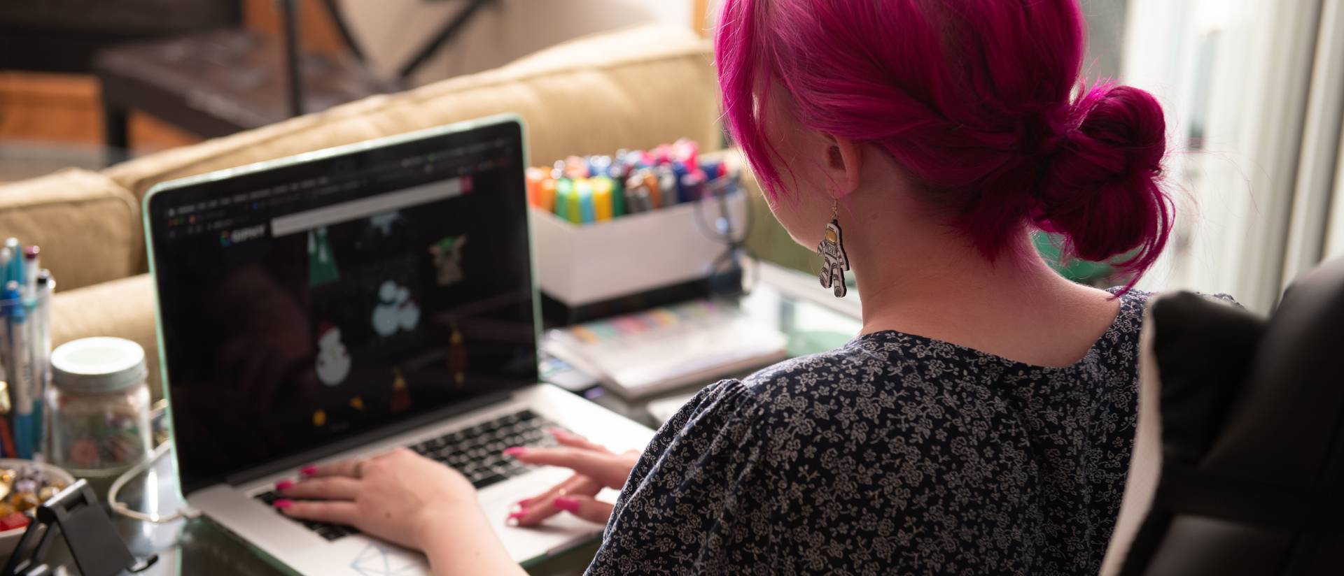 Student works at their computer in their dorm room.