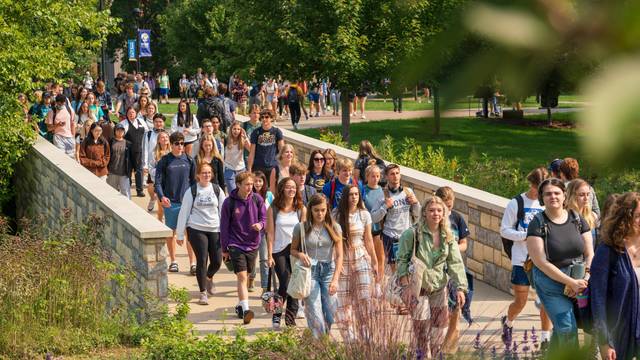 Students make their way through lower campus on a warm summer.