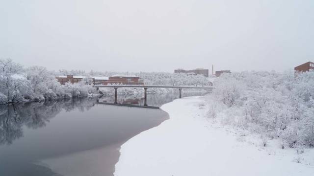winter scene of footbridge and river