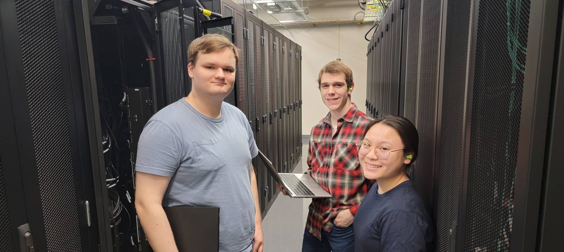 The HPC student admins located in the data center that houses the BOSE supercomputing cluster.