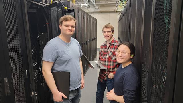 The HPC student admins located in the data center that houses the BOSE supercomputing cluster.