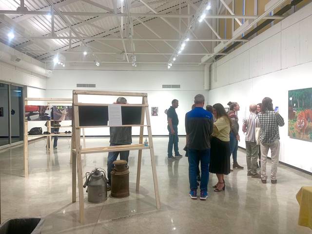 People looking at artwork in the gallery