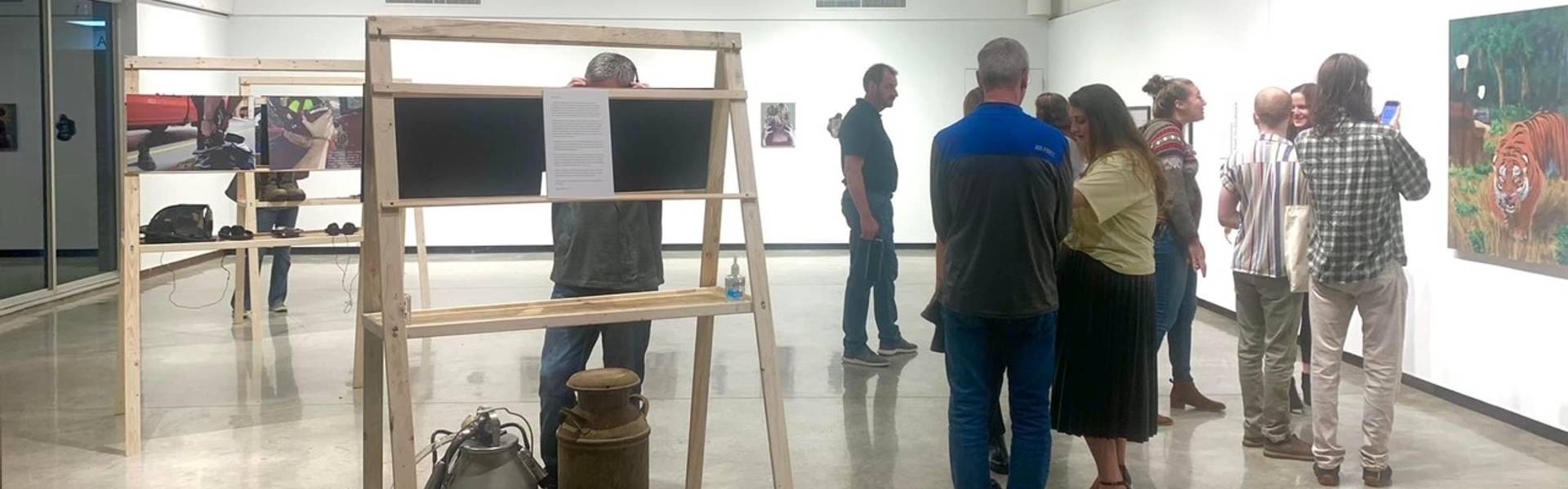 People looking at artwork in the gallery