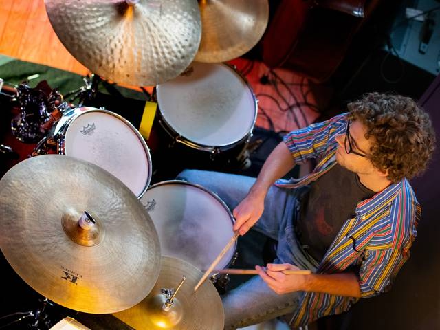 overhead view of a drum set being played in a Jazz Crawl venue