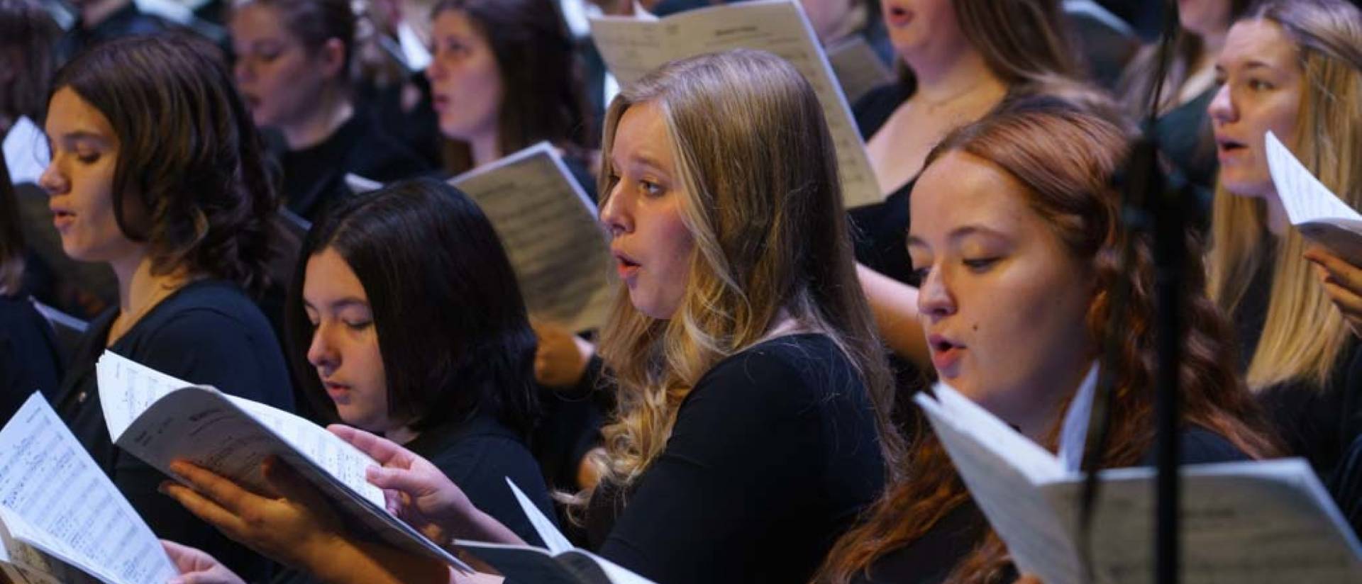 female choral singers in black dresses