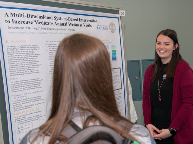 Grad student presents research poster