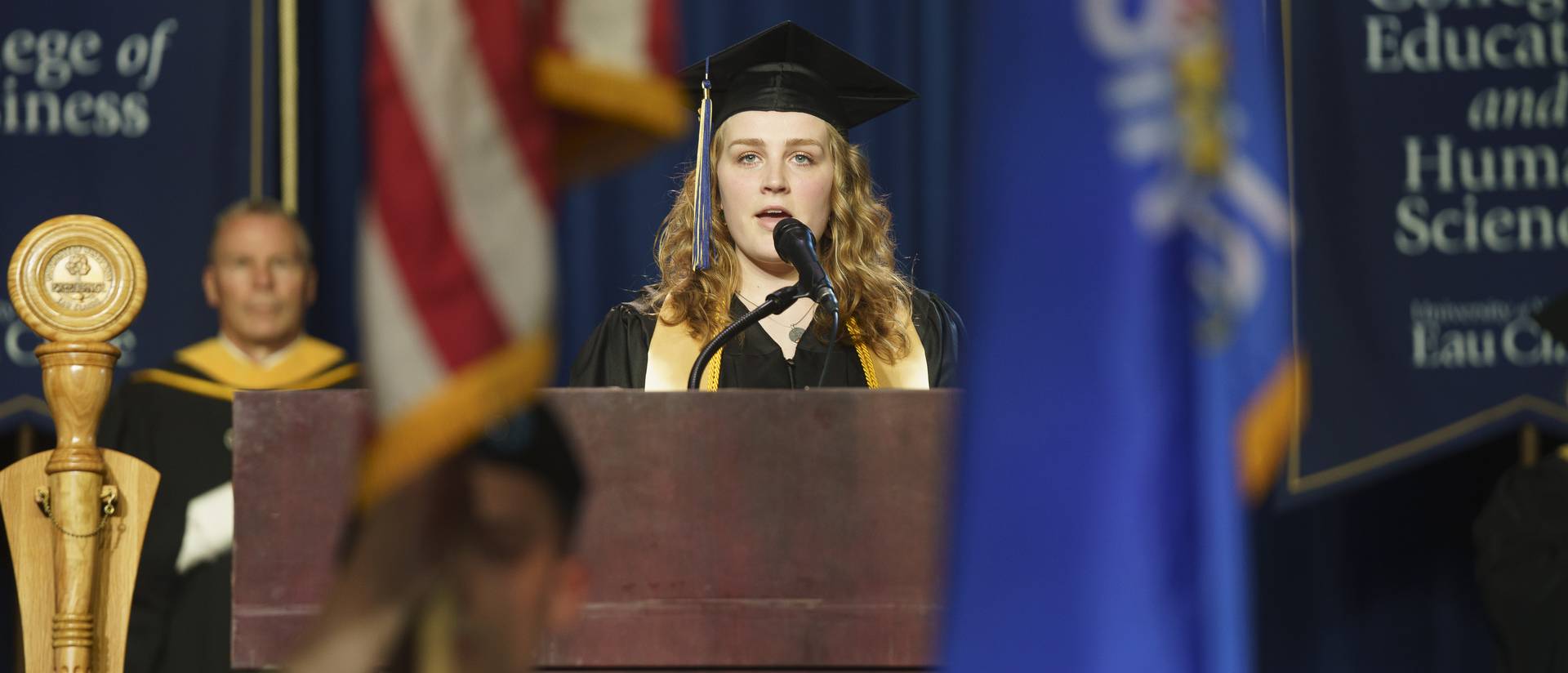 female student singing at the commencement ceremony