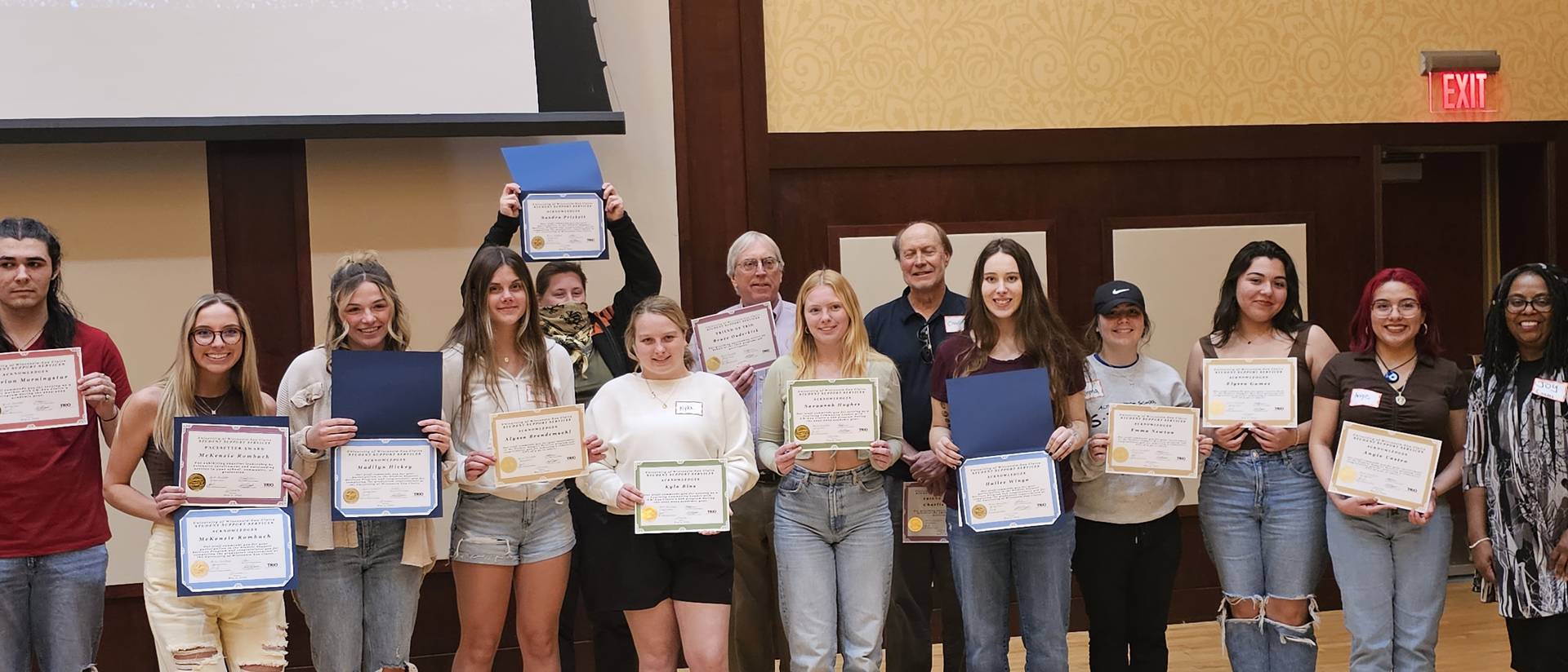 Student Support Services participants holding their recognition certificates from their accomplishments during the semester.