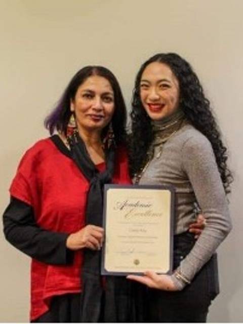 Yuna Khab (right) with Dr. Chandra Talpade Mohanty (left) holding up award