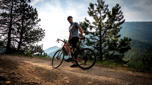 man on a bike on a mountain trail