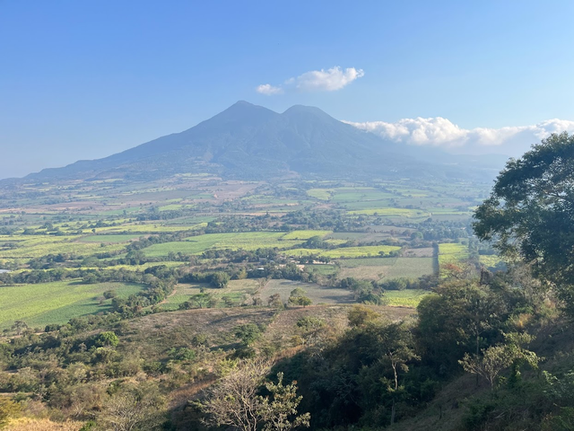lanscape scene in El Salvador including a distant volcano