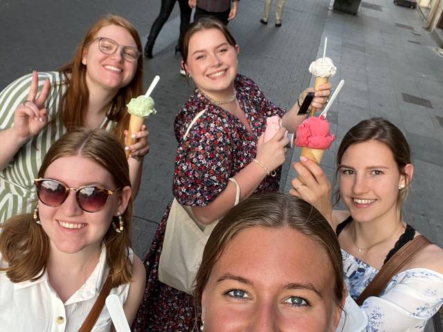 girls with ice cream cones on a cobblestone street in Spain