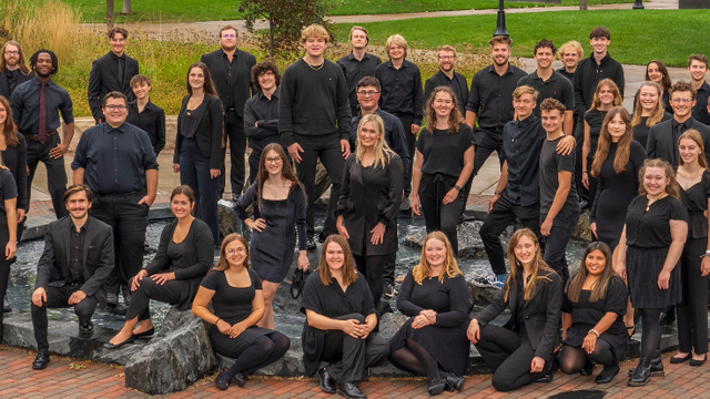 2023 Concert Choir members in front of a fountain on the UW-Eau Claire campus