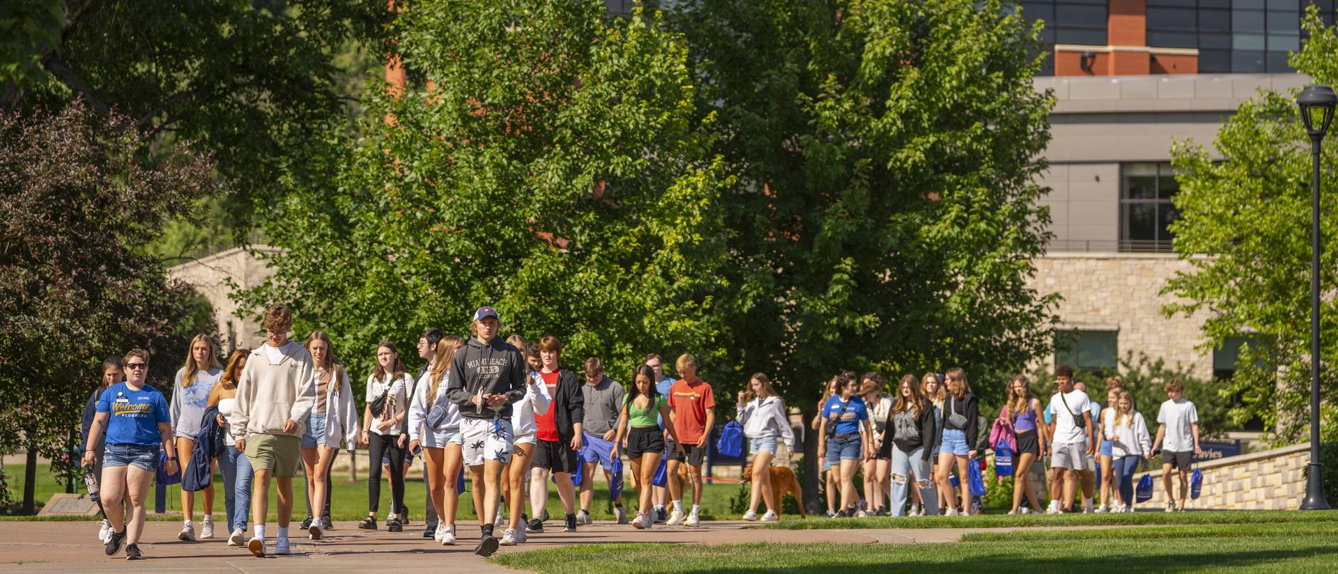 students attending Blugold Experience Day walking through campus mall