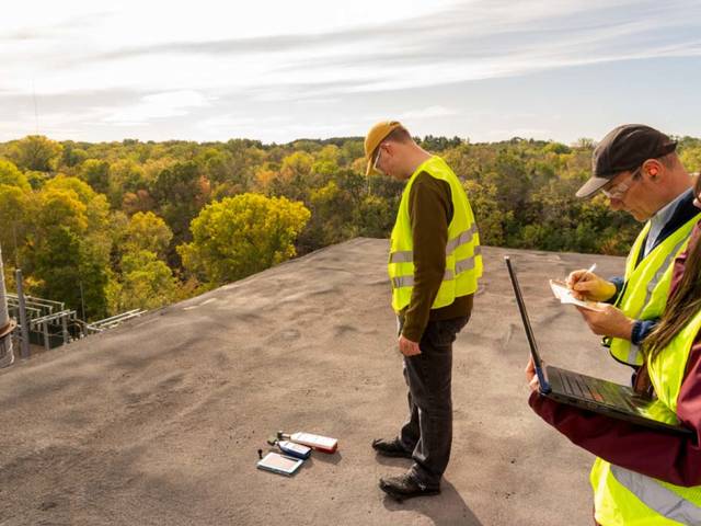 Environmental public health students and faculty on the roof of Banbury collecting data
