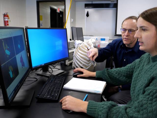 Maya Frodl and Doug Dunham in MSE computer lab with 3D printed ribcage