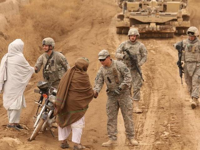 Dan Rose and fellow soldiers talking with Afghans in 2008.