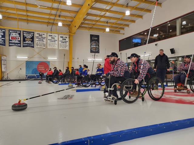 Dan Rose and teammate on the curling ice for practice