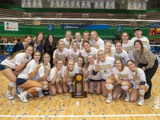 The UW-Eau Claire volleyball team poses for a photo after winning the 2021 NCAA national championship.