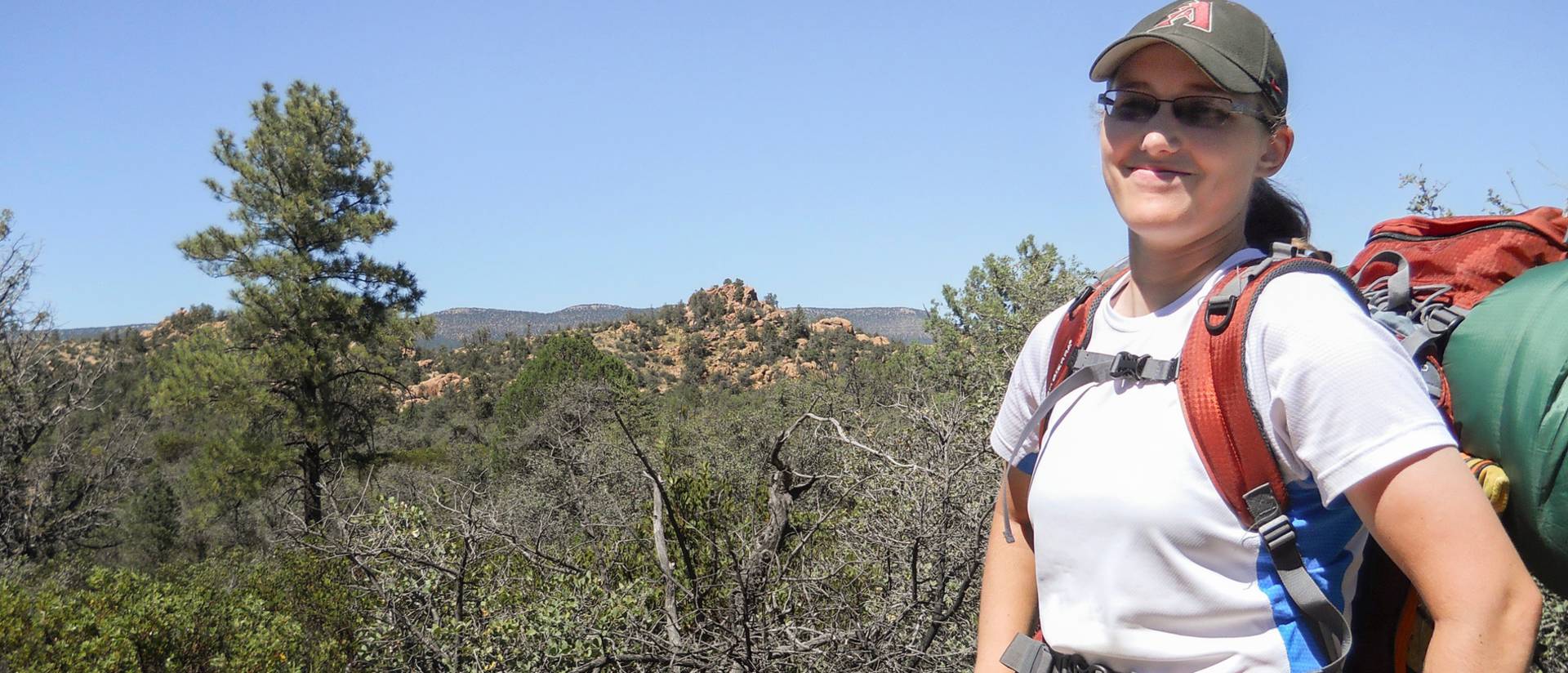 Brielle Cummings hiking in the Apache Creek Wilderness area