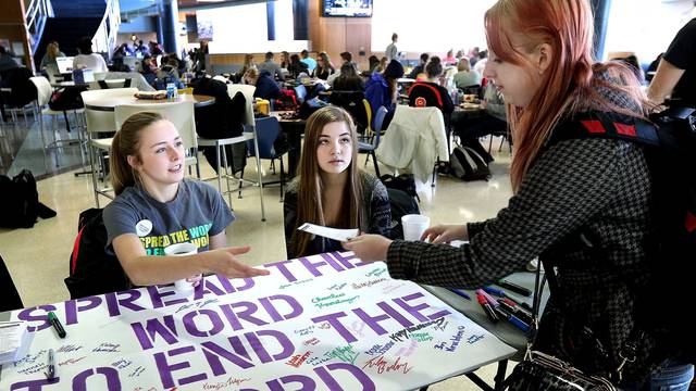Annie Behnke and Kelsi Kruchten take pledges to end the R word at Davies Center