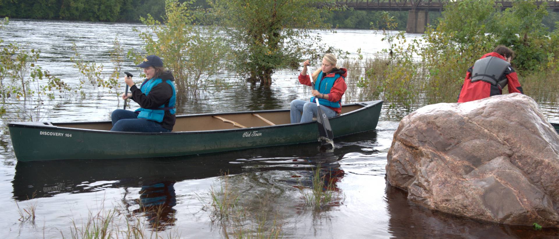 UWEC biology students canoeing on a field research trip