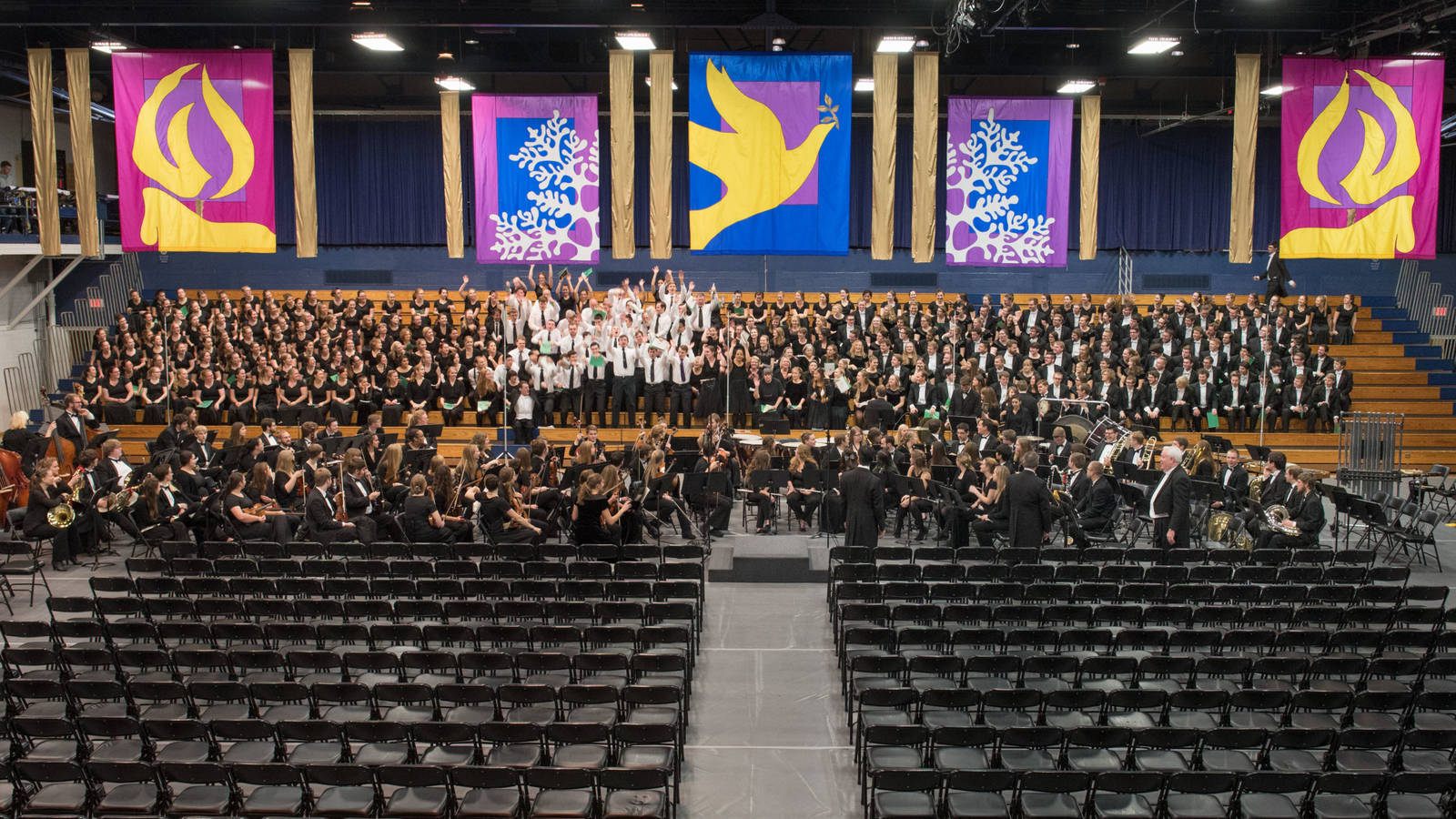 Multiple choral, band and orchestra groups join together for the annual Holiday Concert.
