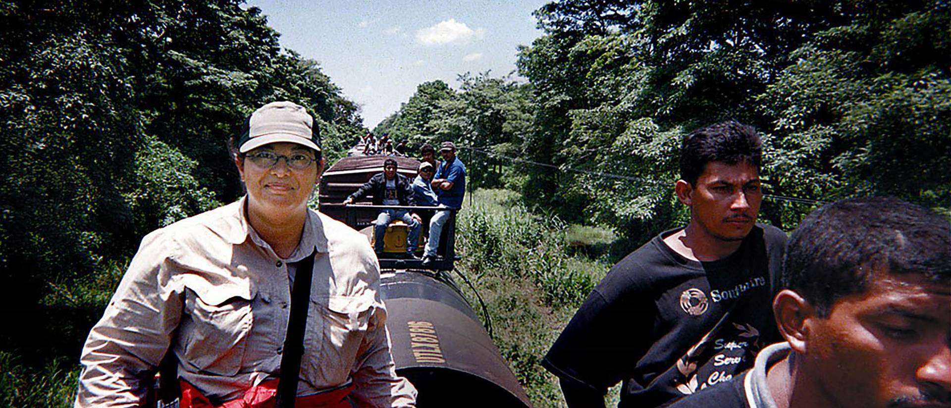 Author Sonia Nazario riding atop freight trains in Mexico