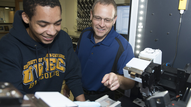 Doug Dunham in lab with Tayo Sanders