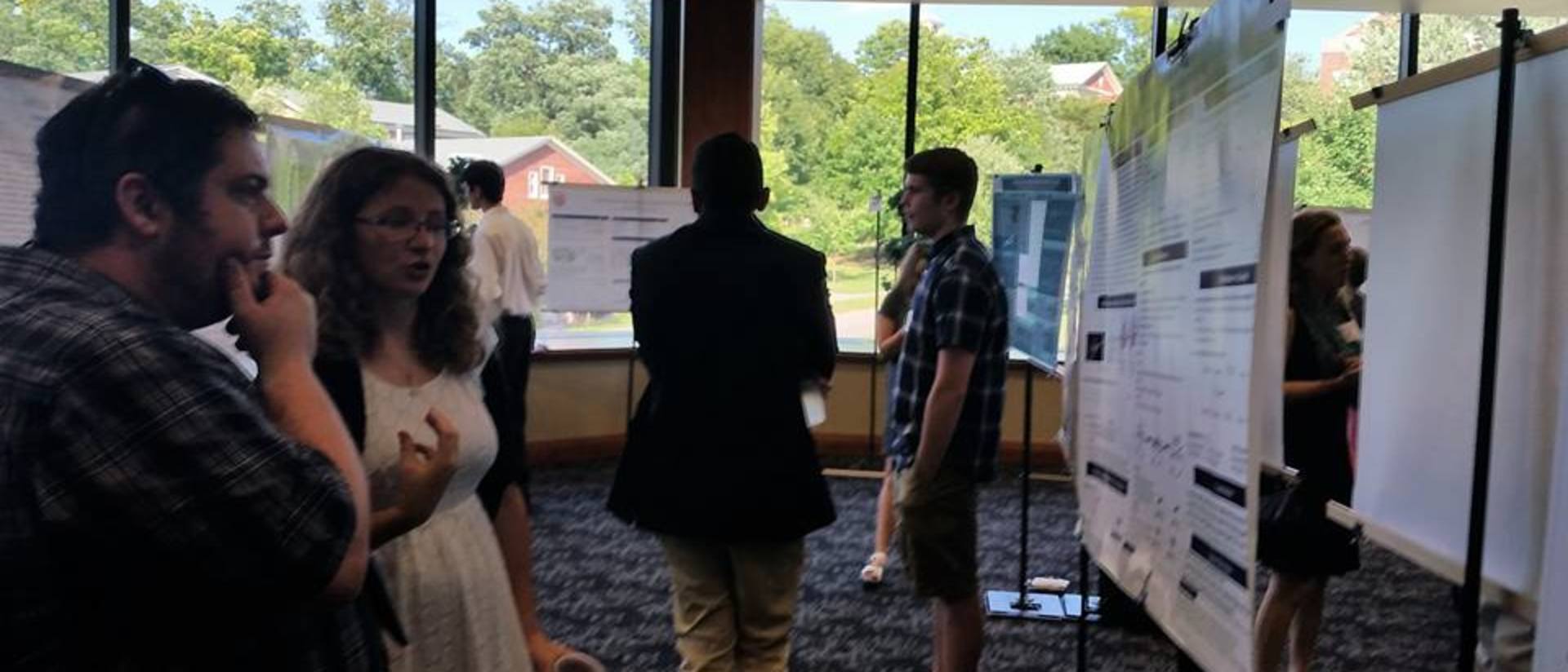 Students presenting research at a conference
