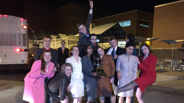 Forensics team with trophy