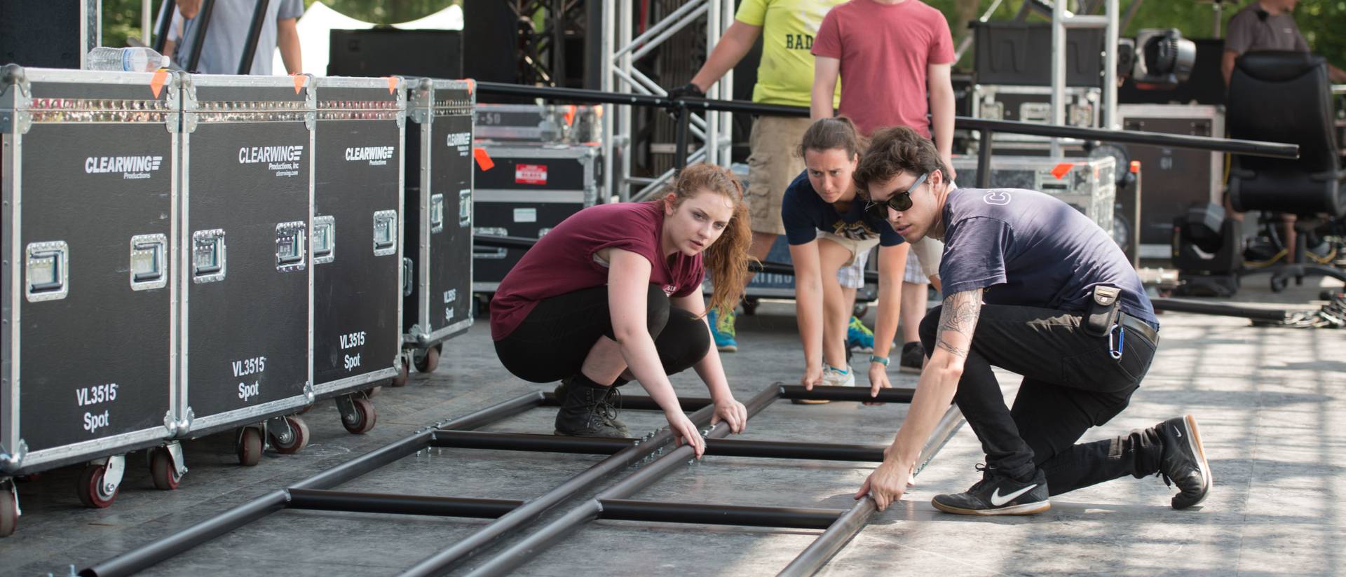 Three members of UW-Eau Claire's Event Production Crew work at the 2015 Eaux Claires festival.
