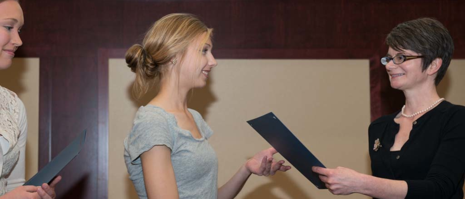 English student scholars at an award ceremony.