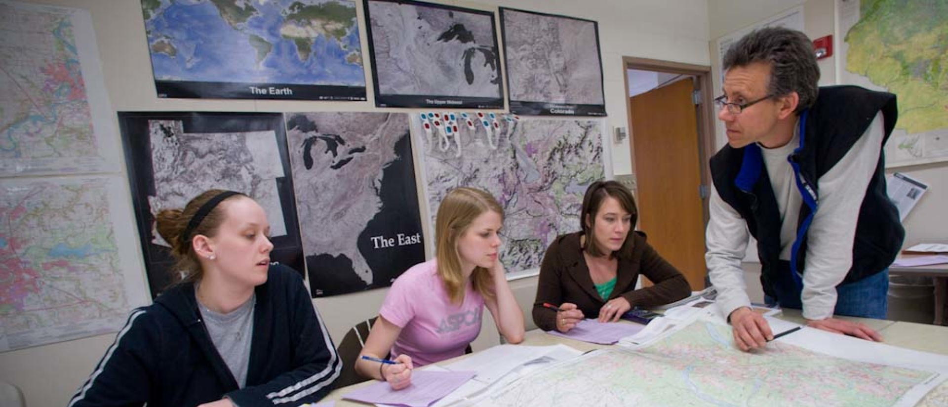 A professor instructs students.