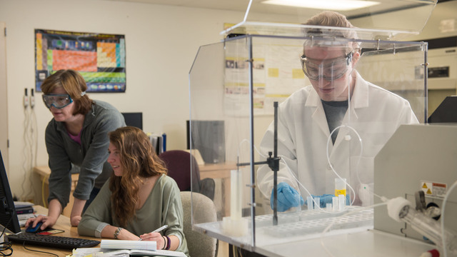 student in geochem lab