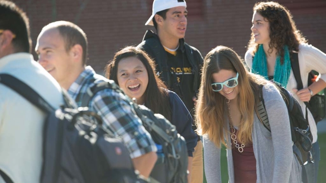 Students laughing while walking