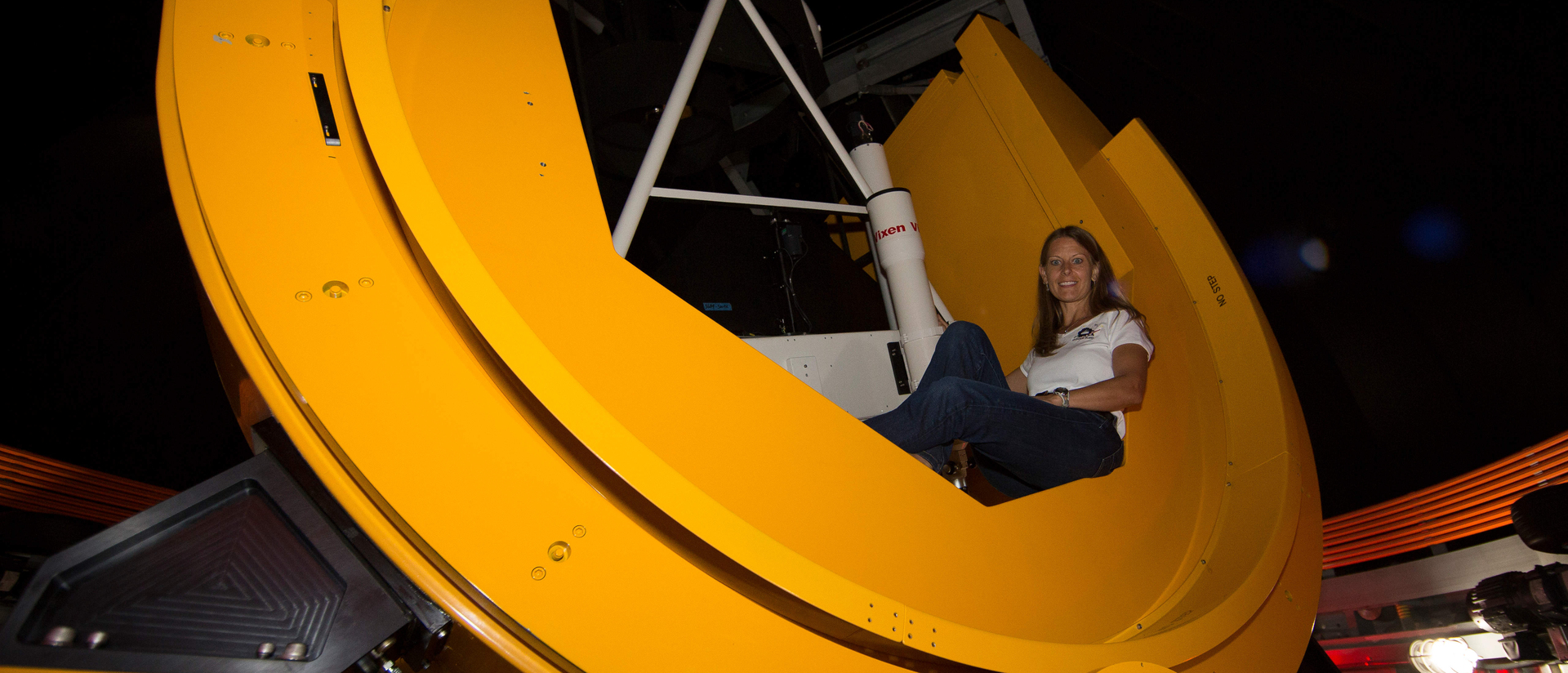Alumna Susan Lederer in telescope she built for NASA