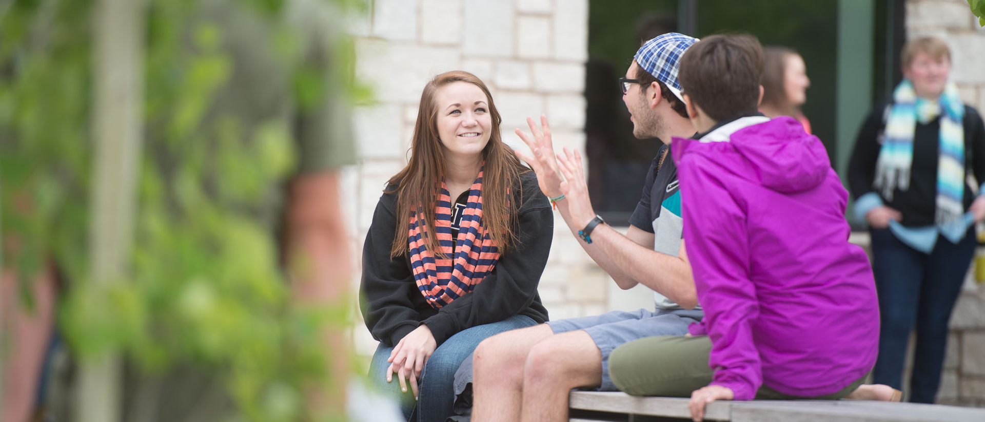 Students sitting outside of Davies