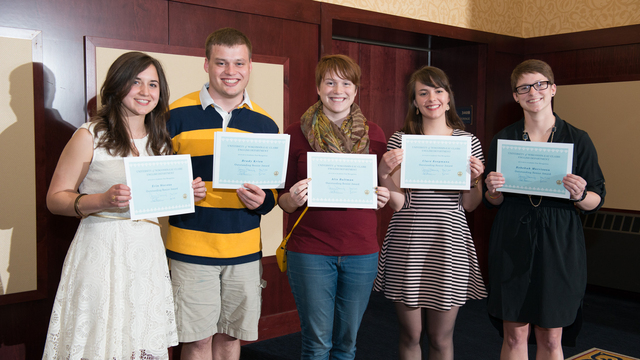 UWEC students posing with scholarships